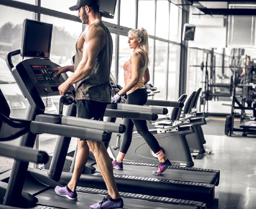 Young,Adult,Man,And,Woman,Doing,Running,Exercise,On,Treadmill List of Fitness Centers